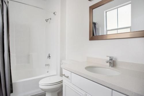 a bathroom with a toilet and a sink and a mirror at Century City 2br w bbq wd nr mall shops LAX-1063 in Los Angeles