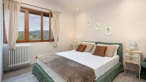 Postel nebo postele na pokoji v ubytování TERRAZZA SULLA VALLE 4&2, Emma Villas
