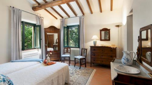 En eller flere senge i et værelse på VILLA PAESANTE 8, Emma VIllas