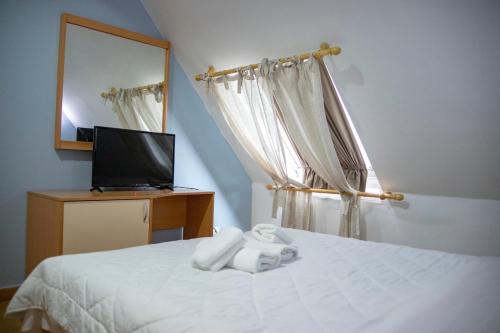 Postel nebo postele na pokoji v ubytování Hotel Oaz