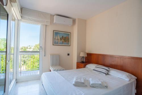 Postel nebo postele na pokoji v ubytování Casa Cala Balmins