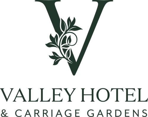 a logo for valley hotel and carnegie hotel and gardens at The Valley Hotel & Carriage Gardens in Fivemiletown