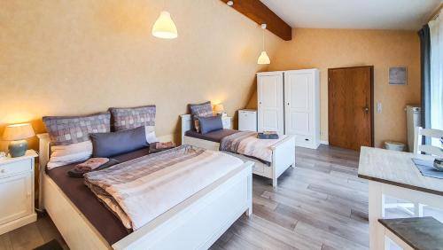 Postel nebo postele na pokoji v ubytování Friendly Home - Klinkerhof