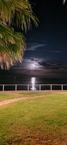 a view of the ocean at night with the moon at VISTAS AL MAR 2 in Oropesa del Mar