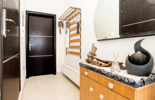 a kitchen with a dresser and a mirror at Kellys house in Epanomi