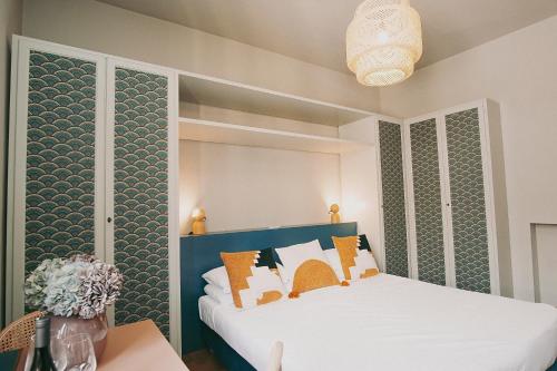 a bedroom with a bed with a blue headboard at Salotto Monti in Rome