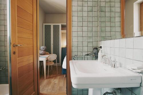 a bathroom with a sink and a mirror at Salotto Monti in Rome