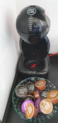 a plate of donuts sitting on top of a blender at JOSE APARTAMENTo in San Jose de la Rinconada