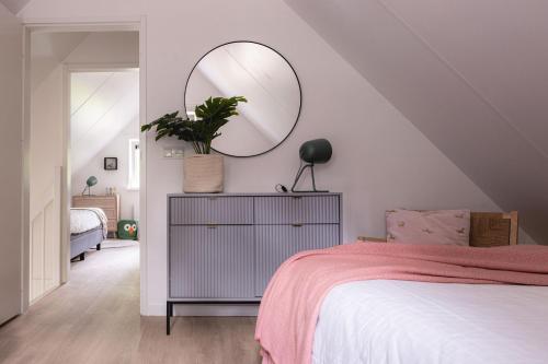 Postel nebo postele na pokoji v ubytování Luxe Vakantiehuis Koekoek Veluwe