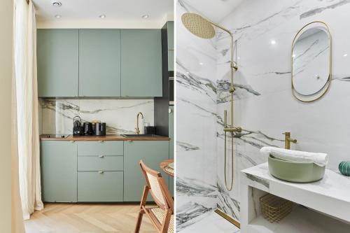 une salle de bain avec un lavabo et un miroir dans l'établissement Apartment Champs Elysée bu Studio prestige, à Paris
