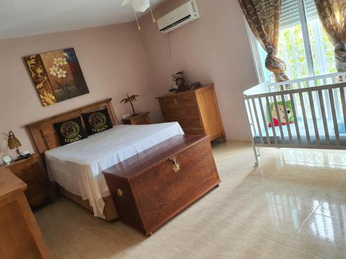 a bedroom with a large bed and a staircase at Finca amor y sueño isa in Rafal
