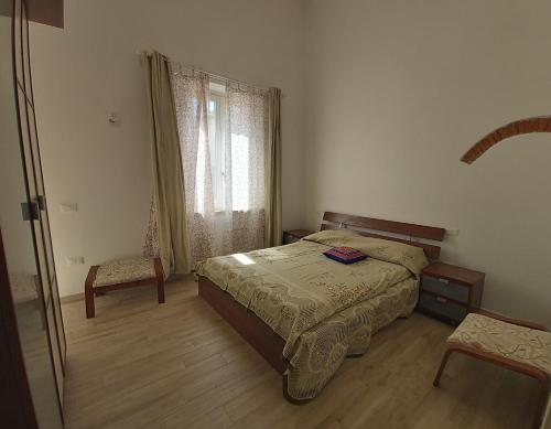 En eller flere senge i et værelse på Agriturismo Podere Il Fitto