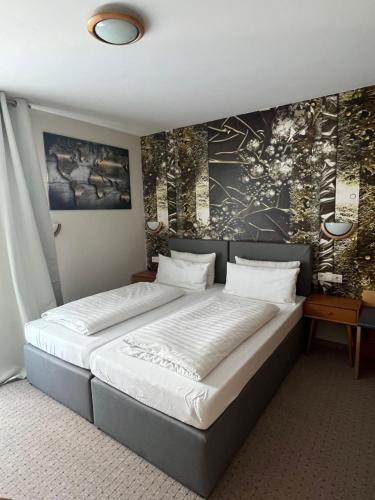 Postel nebo postele na pokoji v ubytování Hotel Aggertal
