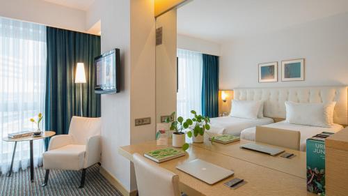 Ένα ή περισσότερα κρεβάτια σε δωμάτιο στο Wyndham Ankara
