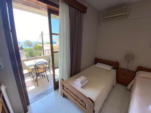 Postel nebo postele na pokoji v ubytování Hotel Pavlos - Studios