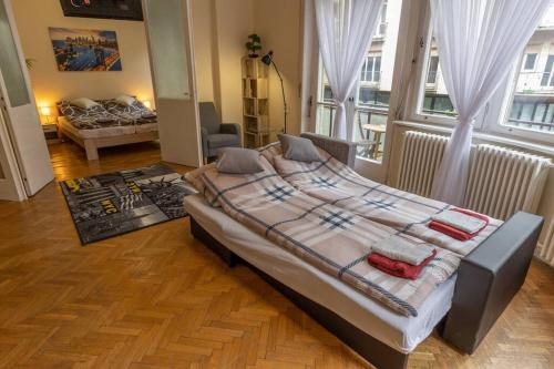 a bedroom with a large bed in a room at Best Location, Family friendly Panorama view by NW in Budapest