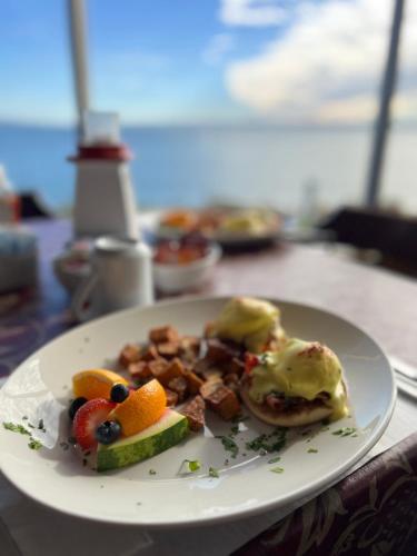 a white plate with breakfast food on a table at Admiral Digby Inn Restaurant and Cottages in Digby