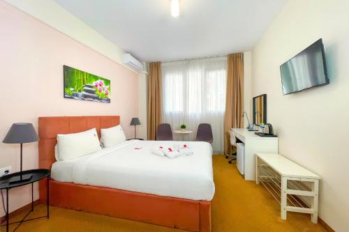 TV a/nebo společenská místnost v ubytování City Plaza Apartments & Rooms