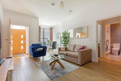 a living room with a couch and a table at 1 Bed Apartment - Redhill Central, Surrey, Gatwick #3 in Redhill
