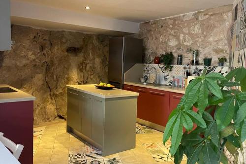 a kitchen with a counter with bananas on it at La Morada de Creta in Aren
