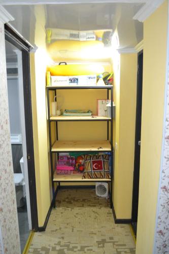 a room with a closet with yellow walls at Family & Relax Loft Lake House in Zagalʼtsy