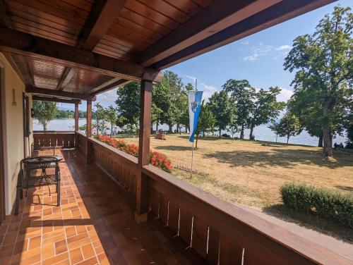 a porch with a view of the water at Apartments Fischerklause am Bodensee in Wasserburg am Bodensee