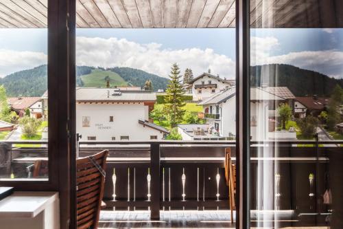 a view from a balcony with a view of the mountains at Haus Excelsior Top 31 in Seefeld in Tirol