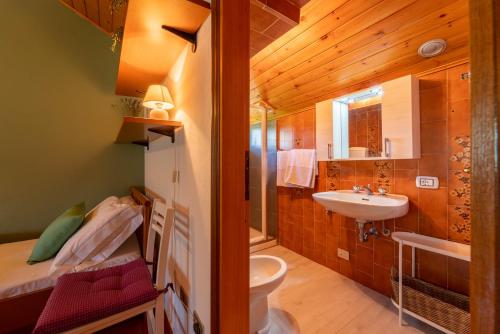 a bathroom with a sink and a toilet at Costa Prada Country House by Wonderful Italy in Bellagio