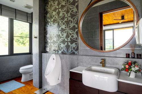 a bathroom with a sink and a mirror at President R1-3 The Height Khaoyai 3BR byน้องมังคุด in Ban Huai Sok Noi
