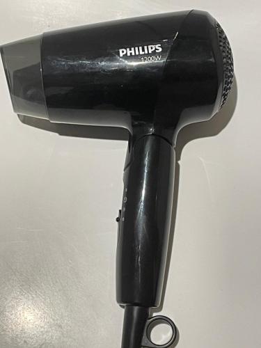 a hair dryer sitting on top of a pole at Stebuklas coliving in Vilnius