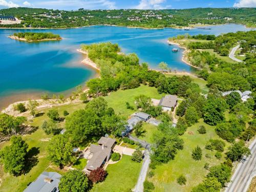 an aerial view of a house on the shore of a lake at Lake Escape Lakefront Lodge at Red Bud Cove in Hollister