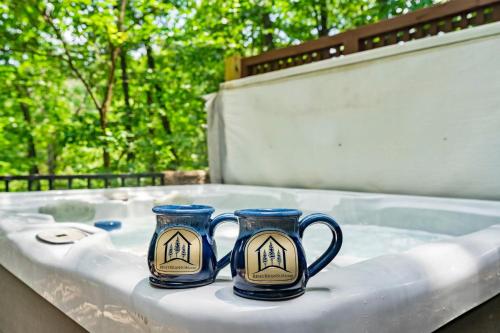 three blue coffee mugs sitting on a table at Dogwood Tree Cabin in Ridgedale