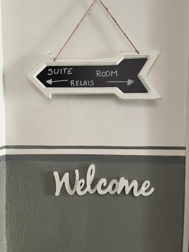 a black and white sign hanging on a wall at Relais Dei Mandorli suite centro in Bergamo