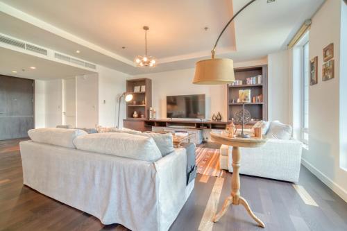 a living room with a couch and a table at Limestone House, Dubai International Financial Centre - Mint Stay in Dubai