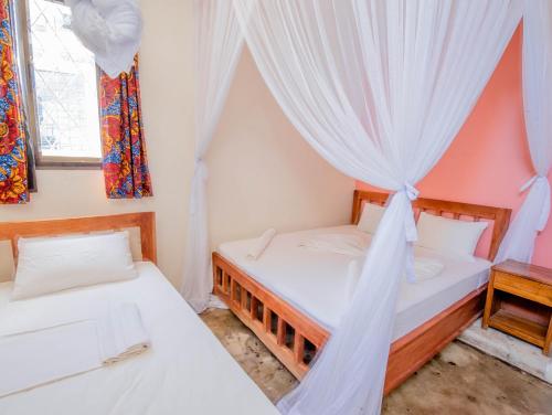 Postel nebo postele na pokoji v ubytování The Slow Leopard