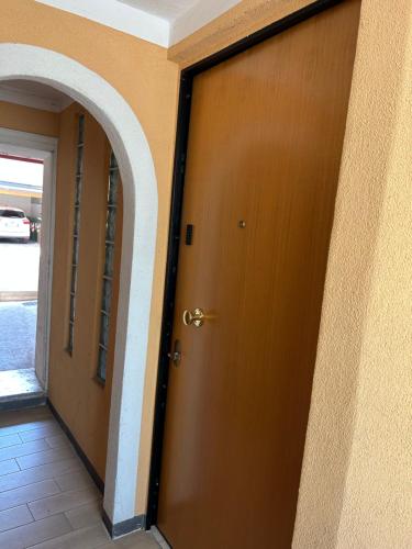 a door to a building with a hallway with a doorway at Larocca Tourist Home 2 in Bassano del Grappa