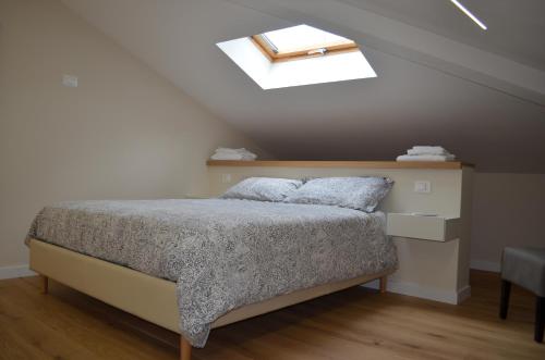 a bedroom with a bed and a skylight at Il Palazzotto in Castel di Sangro