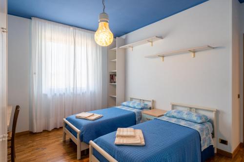 Ένα ή περισσότερα κρεβάτια σε δωμάτιο στο Casa Vittoria