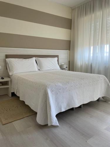 Ένα ή περισσότερα κρεβάτια σε δωμάτιο στο Locanda Kon Tiki
