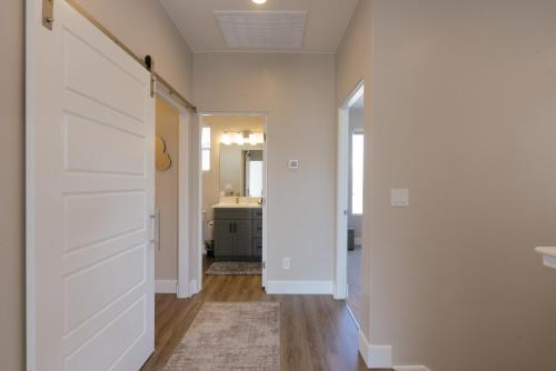 a hallway with a sliding door in a house at Toroweap-4bed,3bath,hot tub,deck in Hildale