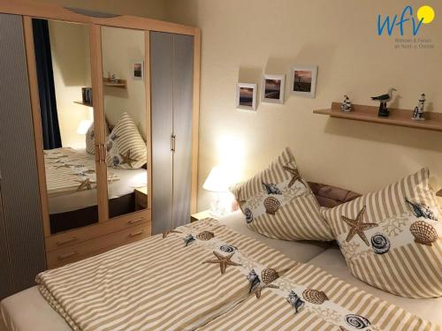 Postel nebo postele na pokoji v ubytování Haus Strandburg Ferienwohnung "Möwenblick"