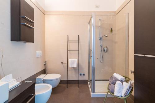 a bathroom with a shower and a toilet at Delle Scienze 11 in Ferrara