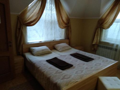 En eller flere senge i et værelse på VILLA VERA