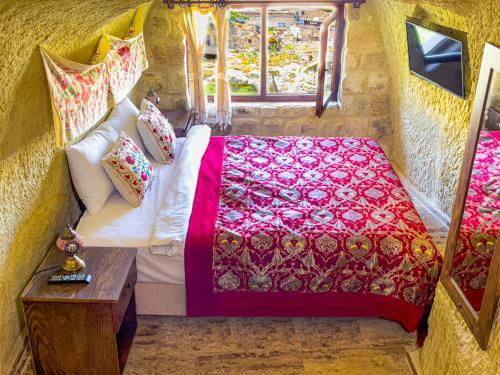 Postel nebo postele na pokoji v ubytování Heritage Cave Suites