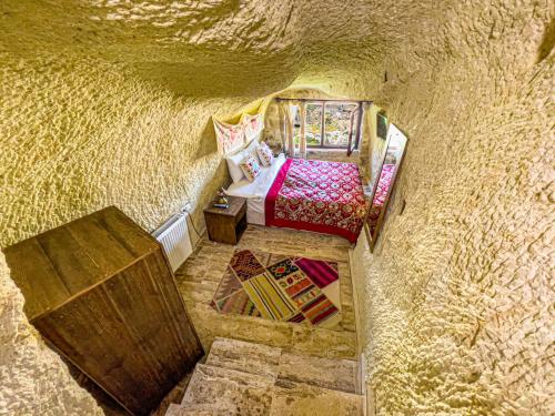Postel nebo postele na pokoji v ubytování Heritage Cave Suites