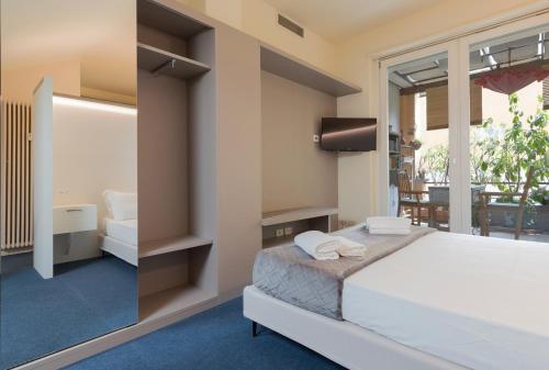 Una cama o camas en una habitación de Milan Retreats Duomo
