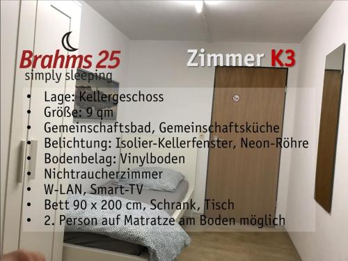 a wall with a sign in a bathroom with a toilet at Brahms 25 in Regensburg
