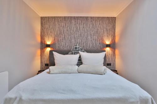 Säng eller sängar i ett rum på Haus Waldburg Appartement 07 "Ahoi"