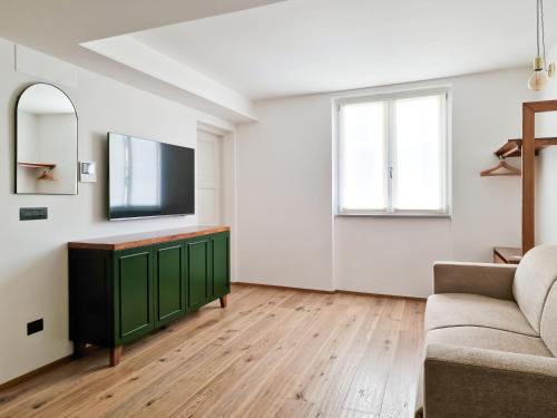 TV a/nebo společenská místnost v ubytování Il Caruggio Flat