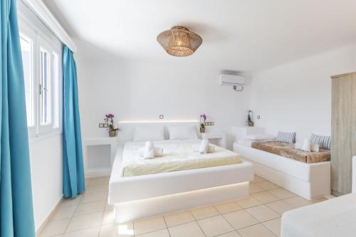 Postel nebo postele na pokoji v ubytování Mykonian Breeze